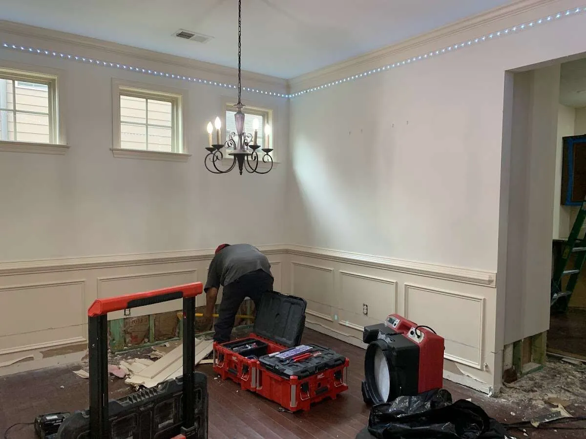 Restoration technician with professional equipment in Hampstead